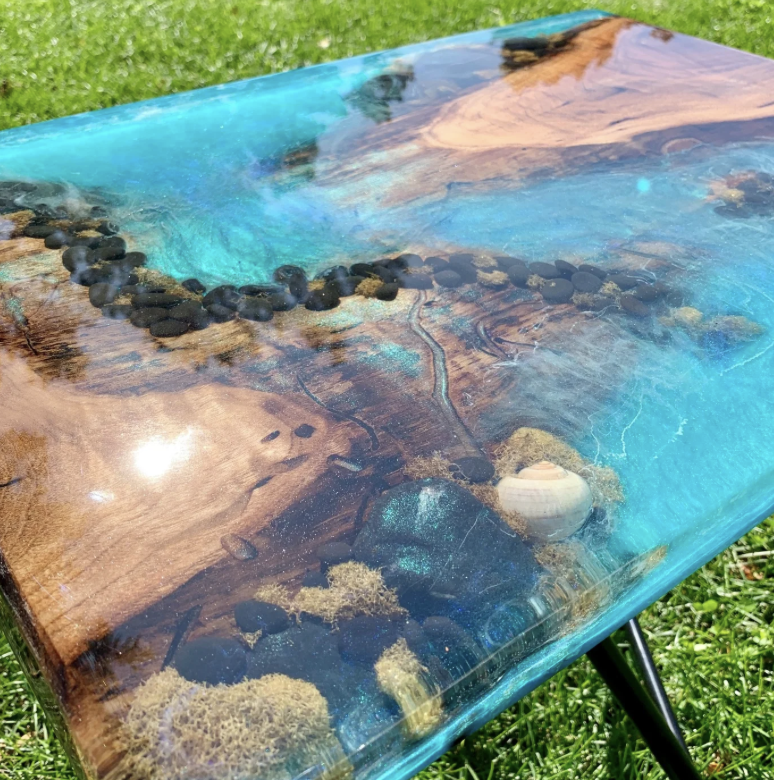 Custom epoxy resin table with ocean theme, live edge wood and turquoise resin